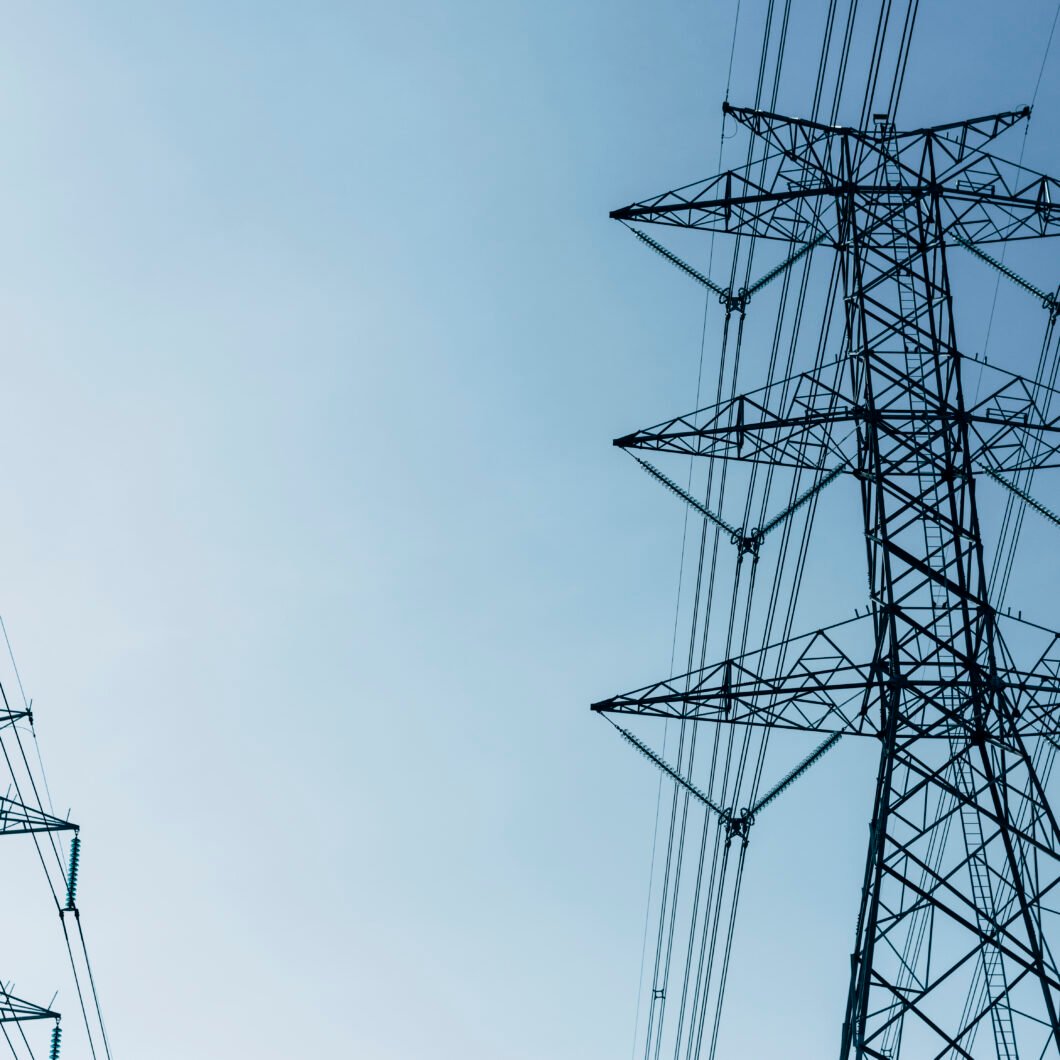High voltage power lines in the blue sky